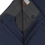 Close-up of a navy blue men's Canali suit jacket with detailed inner lining and Slate Blue Semi-Plain Wool Flat Front Trousers.
