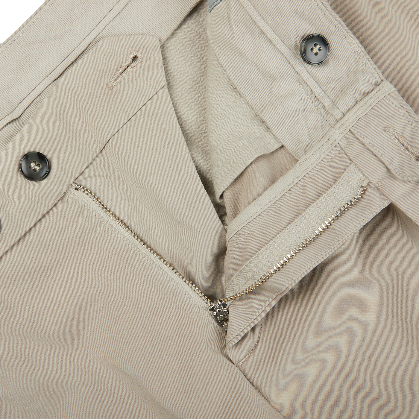 A close up of a pair of distressed Stone Beige Cotton Stretch Flat Front Chinos with zippers by Canali.