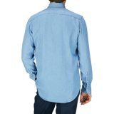 A man in a Canali Washed Blue Cotton Denim BD Casual Shirt is seen from behind.