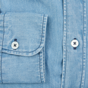 A close up of a Canali Washed Blue Cotton Denim BD Casual Shirt with buttons.