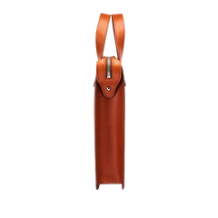 Side view of the Carl Friedrik Cognac Vachetta Leather Vallance Slim Briefcase crafted from Italian vachetta leather, featuring a zippered closure and a handle at the top for a minimalist design akin to a streamlined briefcase.