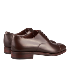 A pair of Brown Calf Rain Captoe Oxford Shoes crafted by Carmina craftsmen.