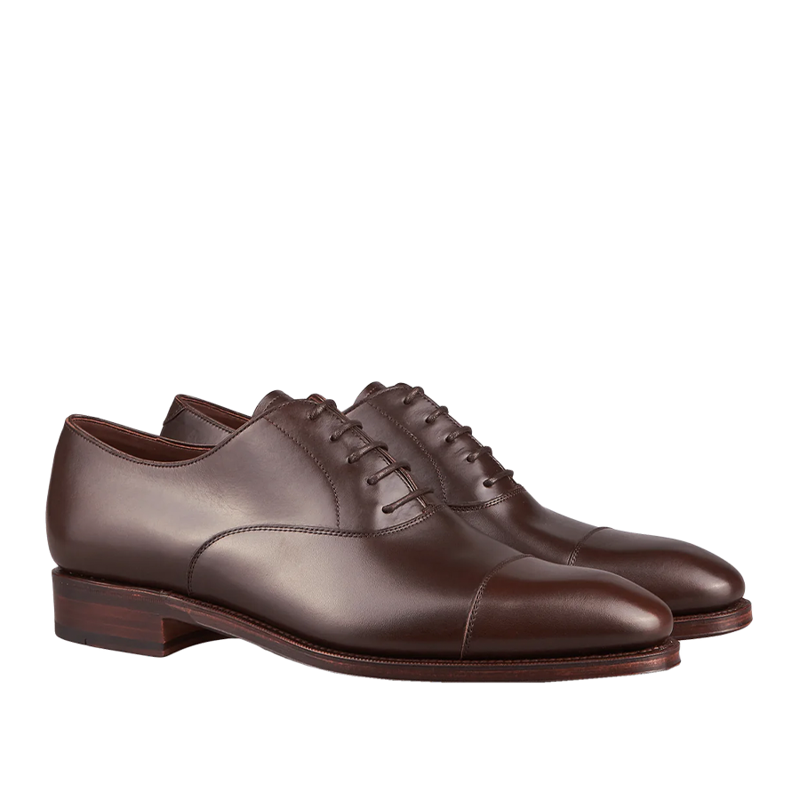 A pair of Carmina's Brown Calf Rain Captoe Rain Oxford Shoes with laces, crafted by expert craftsmen.
