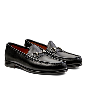 A pair of black Funchal Leather Xim Horsebit loafers by Carmina with metal horsebit detail.