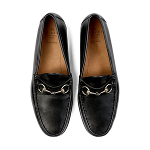A pair of black Carmina Funchal Leather Xim Horsebit loafers with metal horsebit detailing.