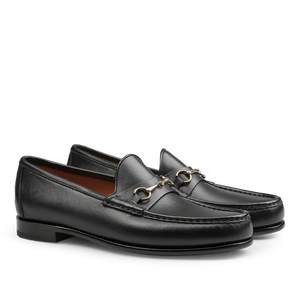 Black Funchal Leather Xim Horsebit Loafers by Carmina, crafted from black calf leather, feature a silver metal buckle detail, a low heel, and elegant stitching along the top edge.