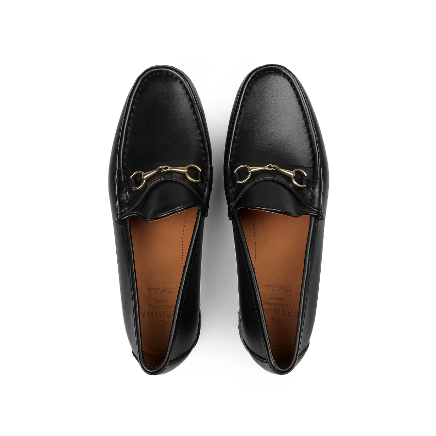 The Black Funchal Leather Xim Horsebit Loafers by Carmina, featuring decorative gold-tone buckles, viewed from above.