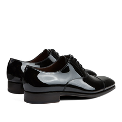 A pair of black Carmina Rain Patent Leather Oxford Shoes.