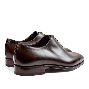 A pair of Carmina Brown Calf Leather Rain Wholecut Oxfords with laces, crafted from calf leather.