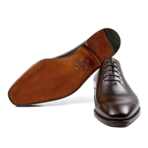 A single Carmina brown calf leather Rain wholecut oxford dress shoe with laces, viewed from a side angle.