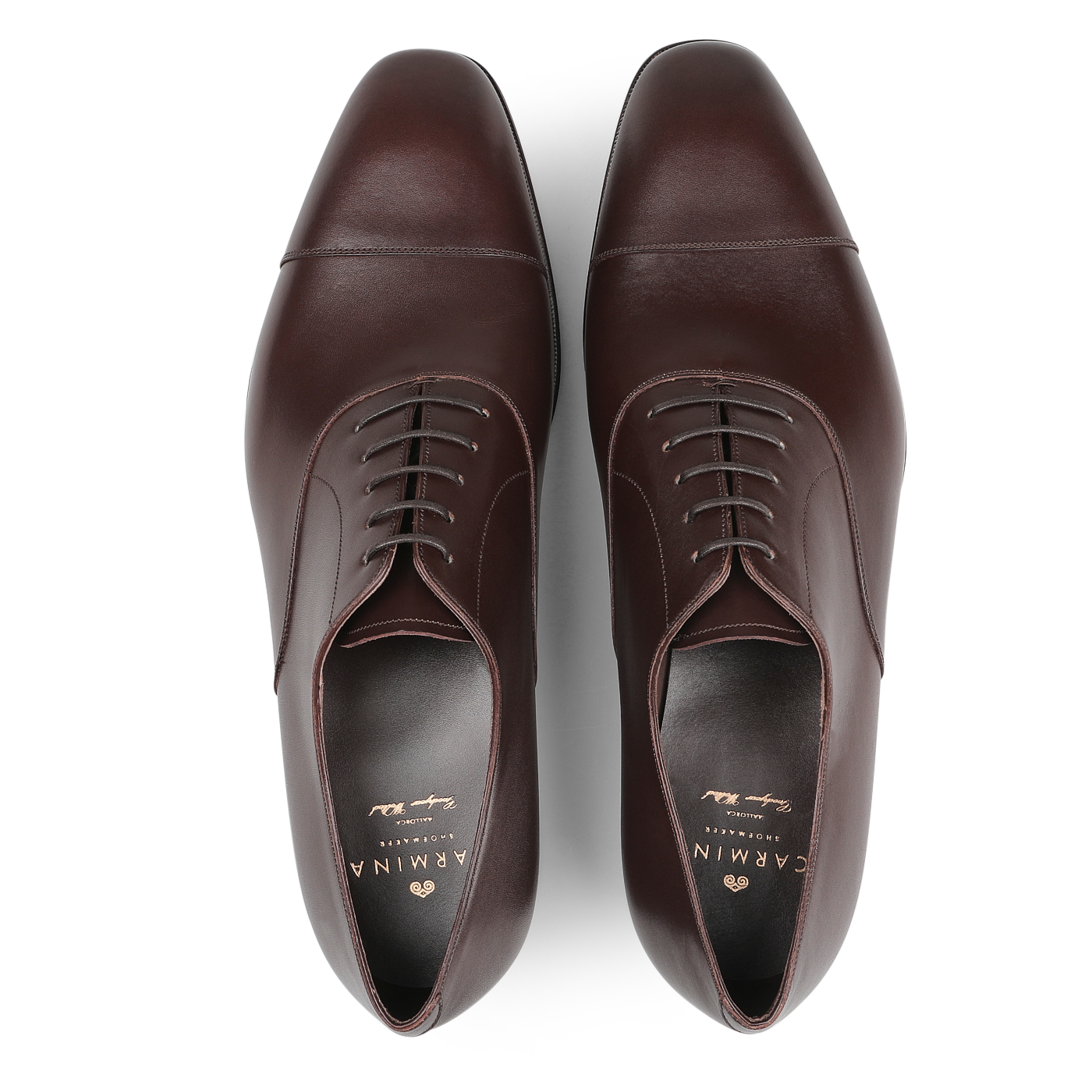 A pair of adaptable Carmina Brown Calf Rain Captoe Oxford Shoes with closed lacing, crafted on the Rain last, displayed from above on a plain background.