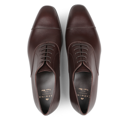 A pair of adaptable Carmina Brown Calf Rain Captoe Oxford Shoes with closed lacing, crafted on the Rain last, displayed from above on a plain background.