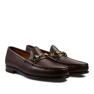 A pair of Brown Funchal Leather Xim Horsebit loafers crafted by skilled craftsmen with gold-tone metal horsebit detail by Carmina.