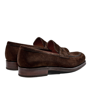 A pair of Brown Suede Forest Rubber Penny Loafers by Carmina, crafted by expert craftsmen, on a white background.