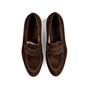 A pair of Carmina Brown Suede Forest Rubber Penny Loafers on a white background, crafted by expert craftsmen.