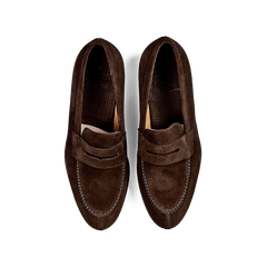 A pair of Carmina Brown Suede Forest Rubber Penny Loafers on a white background, crafted by expert craftsmen.