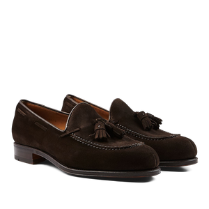A pair of Carmina Brown Suede Forest Tassel Loafers, crafted by expert craftsmen, presented on a neutral background.