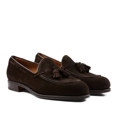 A pair of Carmina Brown Suede Forest Tassel Loafers, crafted by expert craftsmen, presented on a neutral background.