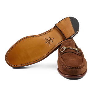 A pair of Tobacco Suede Leather Xim Horsebit loafers with metallic detail, crafted by expert craftsmen using blake-rapid construction by Carmina.