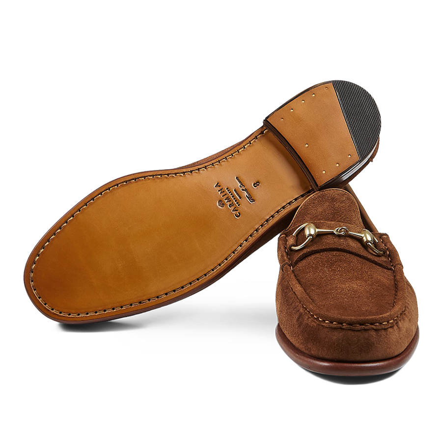 A pair of Tobacco Suede Leather Xim Horsebit loafers with metallic detail, crafted by expert craftsmen using blake-rapid construction by Carmina.