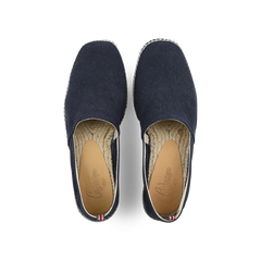 The Azul Oxford Cotton Pablo Espadrilles by Castañer feature an Oxford blue cotton upper, light brown insoles, and a tricolor ribbon on the heel—ideal for effortless summer style.