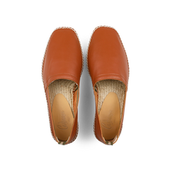 The Castañer Chestnut Brown Leather Pablo Espadrilles feature visible stitching and natural jute woven soles, viewed from above.