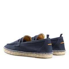 Castañer's Dark Blue Cotton Canvas Nacho Espadrilles showcase a navy upper, tan interior, and straw soles, viewed from the back.