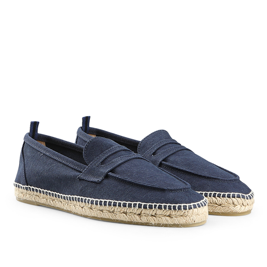 The Castañer Dark Blue Cotton Canvas Nacho Espadrilles feature a cotton canvas upper, rope soles, slip-on design, and subtle top stitching.