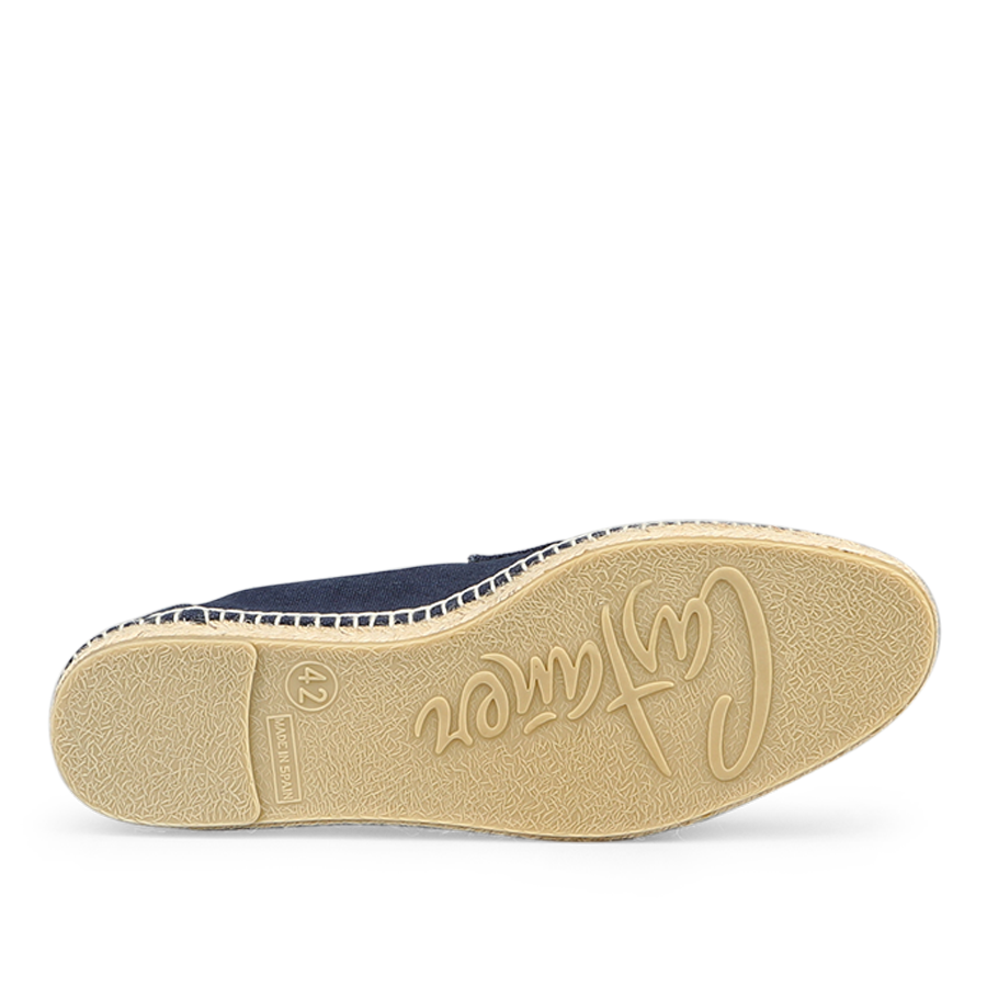 The image showcases the durable rubber sole of a dark blue cotton canvas Nacho espadrille by Castañer, featuring "Creation" inscribed in cursive and size "42" near the heel.