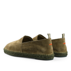 A pair of Castañer Dark Green Suede Leather Pablo Espadrilles with green woven jute soles and orange stitching on the back, shown from a rear angle.