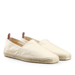 Castañer's Ivory Beige Cotton Pablo Espadrilles are classic summer shoes featuring rope soles and red-striped pull tabs at the back.