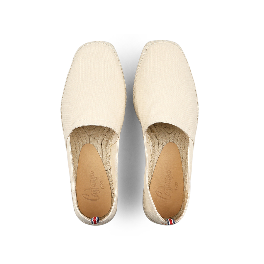 The Castañer Ivory Beige Cotton Pablo Espadrilles, seen from above with their woven soles, are a true summer classic.