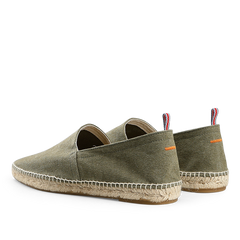 Castañer's Olive Green Cotton Canvas Pablo Espadrilles feature beige soles and tricolor heel tabs, crafted from cotton and natural jute, shown from back and side angles.