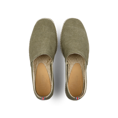 The Castañer Olive Green Cotton Canvas Pablo Espadrilles boast a woven sole of cotton and jute, with a red, white, and blue tag detail at the heel.