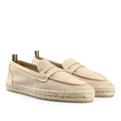 The Sand Beige Cotton Canvas Nacho Espadrilles by Castañer are slip-on shoes crafted with cotton canvas, featuring woven jute soles and a decorative strap across the top.