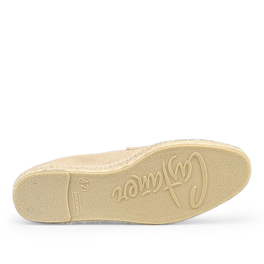 The image displays the sole of the Sand Beige Cotton Canvas Nacho Espadrilles by Castañer, featuring a textured pattern and brand embossing. The durable rubber sole complements the casual design, with a size indicated as "42".