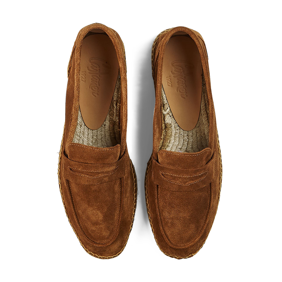 A pair of Castañer Tobacco Suede Nacho Casual Loafers on a striped background.