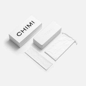 A minimalistic white box with the Chimi Model 04 Ecru Gradient Lenses Sunglasses 45mm logo on it.