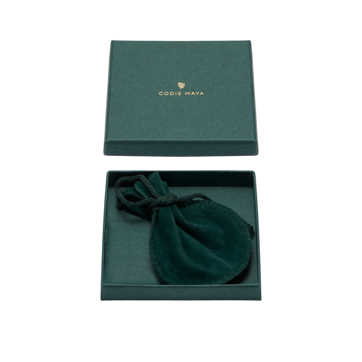 A green box embossed with "Codis Maya" contains a dainty green velvet pouch. Opening the lid reveals the pouch, offering a glimpse of the exquisite Brass Oval End Bracelet it encloses.