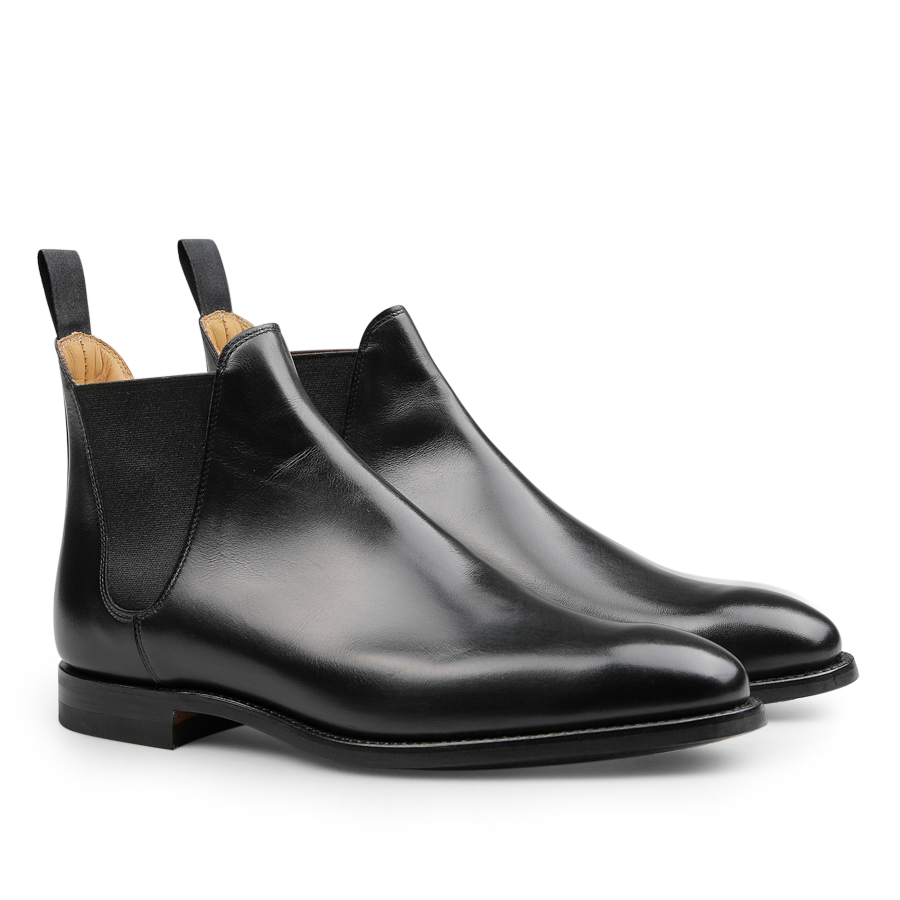 Introducing the Black Calf Leather Chelsea VIII Boots by Crockett & Jones, crafted with sleek fine calf leather, Goodyear welted construction, elastic side panels, and convenient pull tabs.