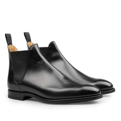 Introducing the Black Calf Leather Chelsea VIII Boots by Crockett & Jones, crafted with sleek fine calf leather, Goodyear welted construction, elastic side panels, and convenient pull tabs.