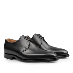 Introducing the Black Calf Leather Highbury Derbies by Crockett & Jones: a sleek pair of dress shoes characterized by a plain-toe derby design, complete with laces and a polished finish.