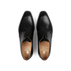 Pair of black leather derbies shot from above, crafted by Crockett & Jones in sleek black calf leather with a nod to the timeless Highbury style.