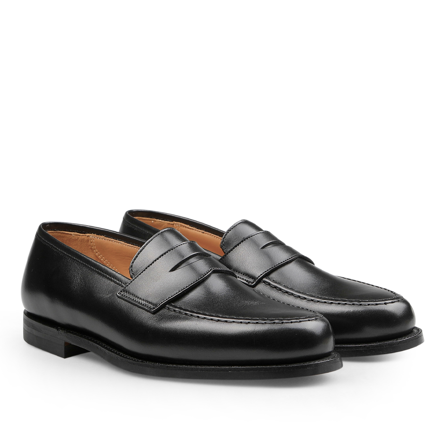 A pair of Crockett & Jones Black Fine Calf Leather Boston Loafers featuring a sleek design and visible stitching, showcased against a plain white background.