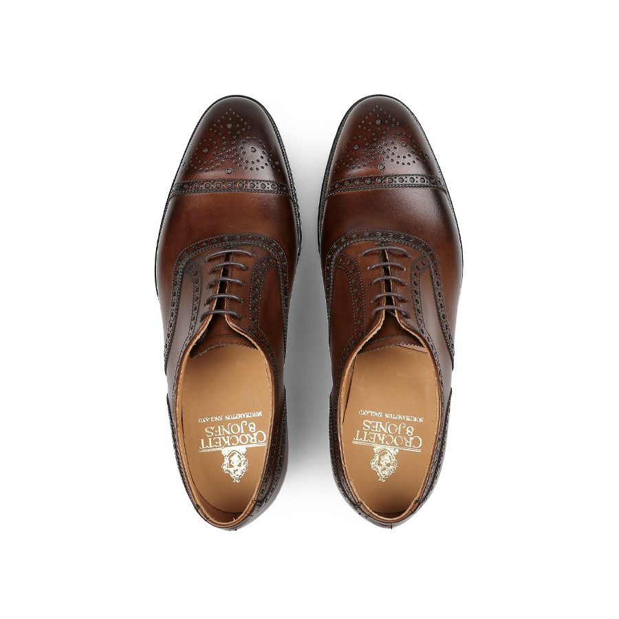 A pair of Crockett & Jones Dark Brown Calf Leather Westfield Semi-Brogues featuring decorative perforations and laces, viewed from above.