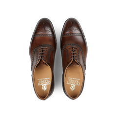 A pair of Crockett & Jones Dark Brown Calf Leather Westfield Semi-Brogues featuring decorative perforations and laces, viewed from above.