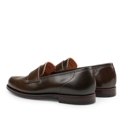 Dark brown cordovan leather Harvard loafers by Crockett & Jones, featuring a low heel, crafted from high-quality Horween cordovan leather and viewed from the back and side.