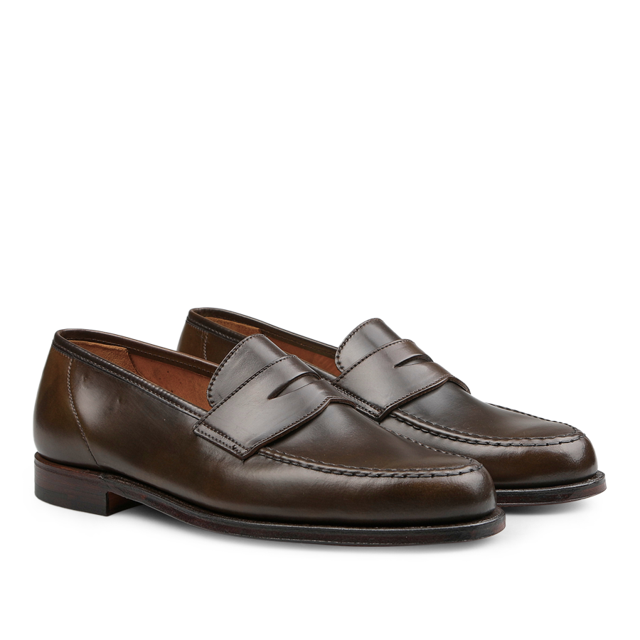 A pair of Dark Brown Cordovan Leather Harvard Loafers by Crockett & Jones, featuring a Goodyear welt construction with visible stitching, round toe design, and crafted from premium Horween leather, displayed on a plain white background.