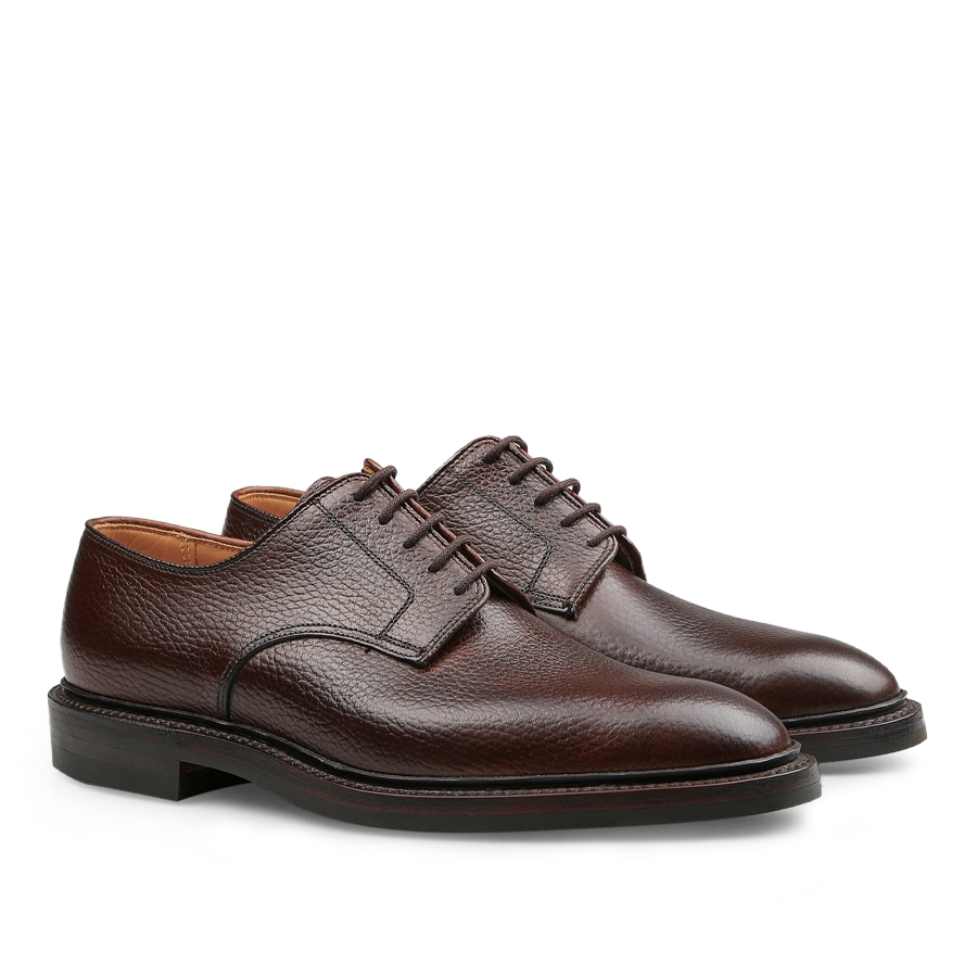 Introducing the Dark Brown Country Calf Grain Ashdown Derbies from Crockett & Jones: These lace-up dress shoes feature a textured surface and a sturdy dark sole, expertly crafted using Goodyear-welted construction.