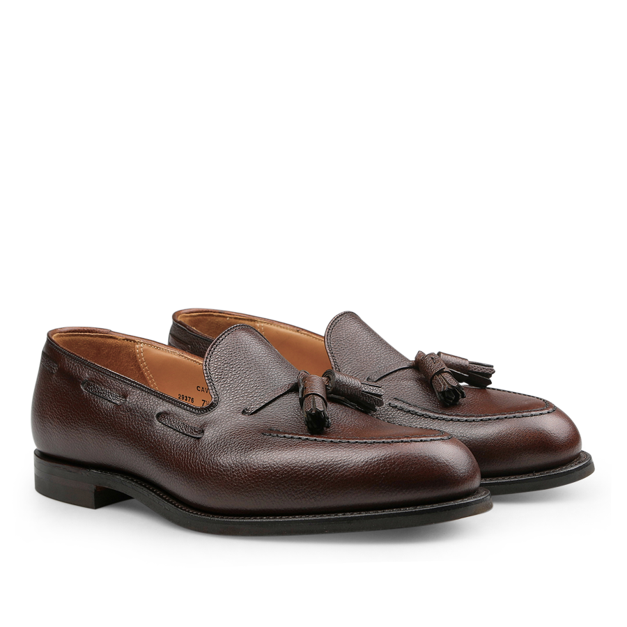 Step into classic sophistication with the Crockett & Jones Cavendish II loafers. Expertly crafted from dark brown pebble grain leather, these loafers feature a smooth finish and a low heel, embodying timeless elegance with their Goodyear-welted construction for enduring quality.